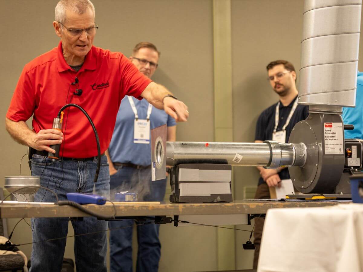 Demonstration of ventilation system testing during an industrial hygiene risk assessment training.